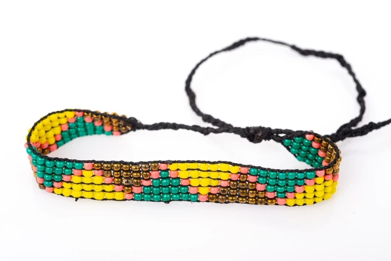 Small beaded bracelet with green, yellow & honey triangle embroidery